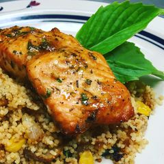 A picture of Sesame Lemon Soy Baked Salmon with a Toasted Couscous Caramelized Onions,Mushroom and, Sweet Corn.