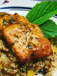 A picture of Sesame Lemon Soy Baked Salmon with a Toasted Couscous Caramelized Onions,Mushroom and, Sweet Corn.