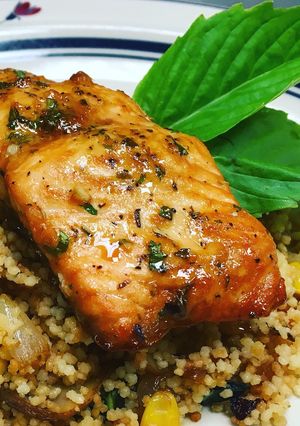 A picture of Sesame Lemon Soy Baked Salmon with a Toasted Couscous Caramelized Onions,Mushroom and, Sweet Corn.