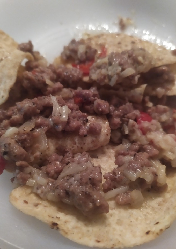 Una foto de Nachos con carne trufada