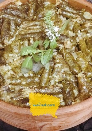 A picture of Grape Leaves Casserole with Lamb Chops.