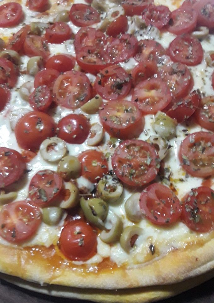 Una foto de Pizza de dos pisos🍕