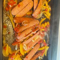 A picture of Baked sausage, pepper & onions.