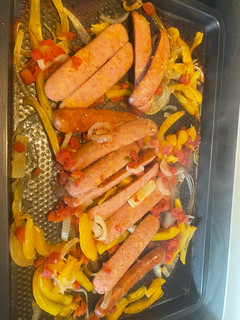 A picture of Baked sausage, pepper & onions.