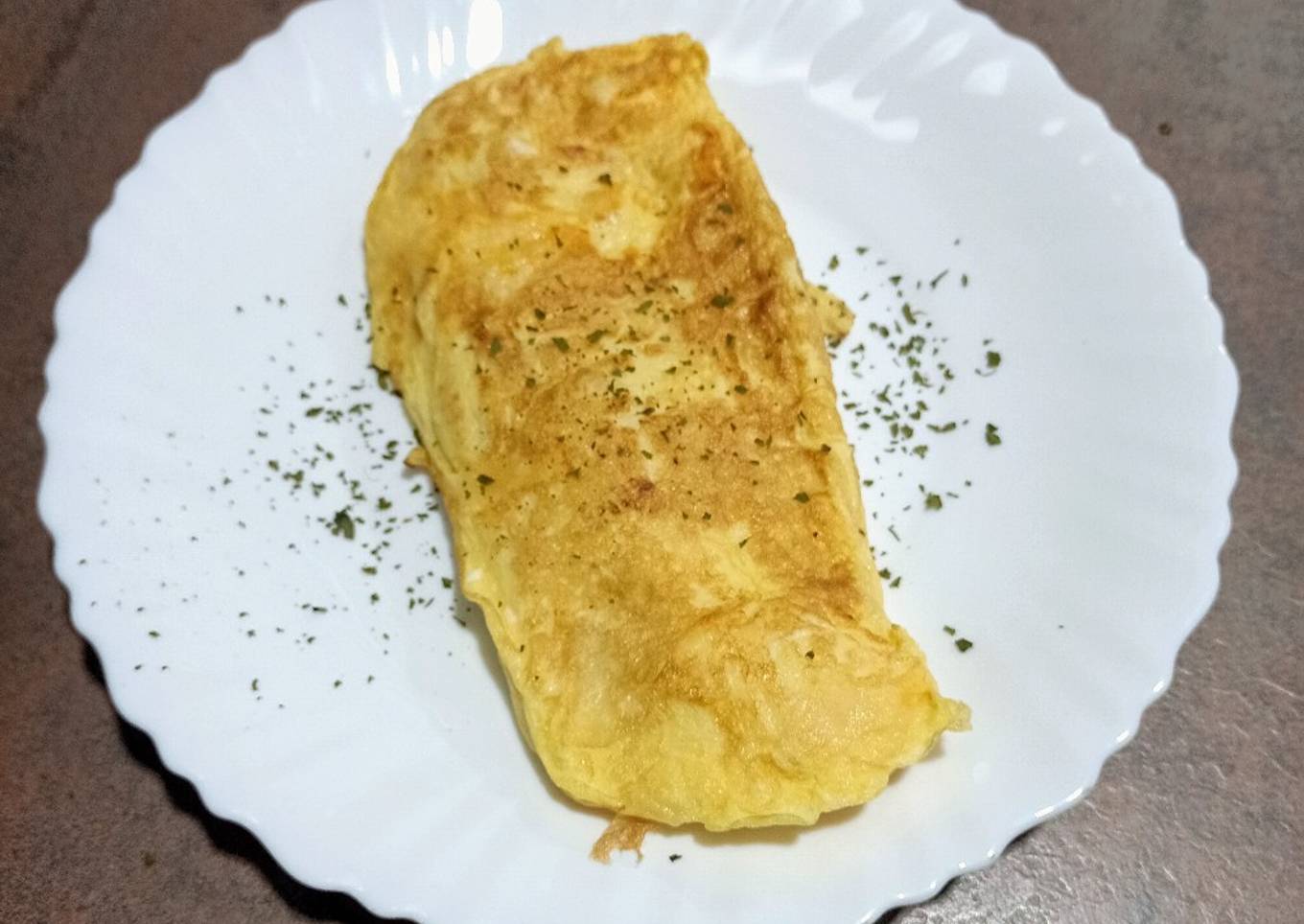 Tortilla francesa con cebolleta y queso Grana Padano