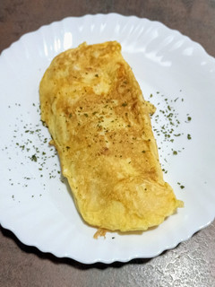 Una foto de Tortilla francesa con cebolleta y queso Grana Padano