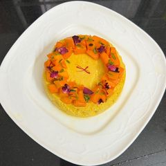 A picture of Mango Bhapa Doi Steamed Dessert.