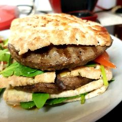 A picture of My Naughty Sandwich Burger with Salad.