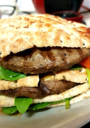 A picture of My Naughty Sandwich Burger with Salad.