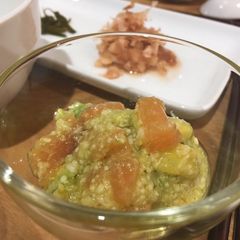A picture of Avocado and Salmon Rice with hot tea.