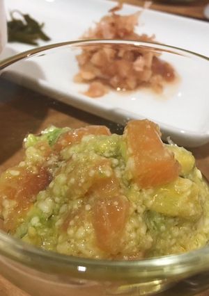A picture of Avocado and Salmon Rice with hot tea.