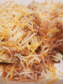 A picture of Chili cheese stuffed potatoe.