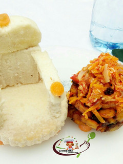 A picture of Boiled yam with carrot egg sauce.