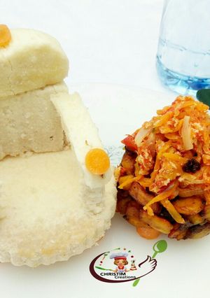 A picture of Boiled yam with carrot egg sauce.