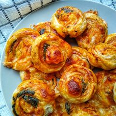 Mozzarella, Tomato & Basil Puff Pinwheels A picture of Mozzarella, Tomato & Basil Puff Pinwheels.