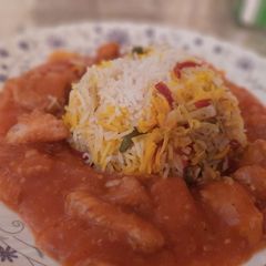 A picture of Egg fried rice with chicken manchurian.