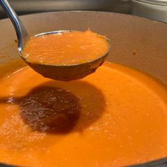A picture of Tomato (with carrot, red pepper and potato) soup.
