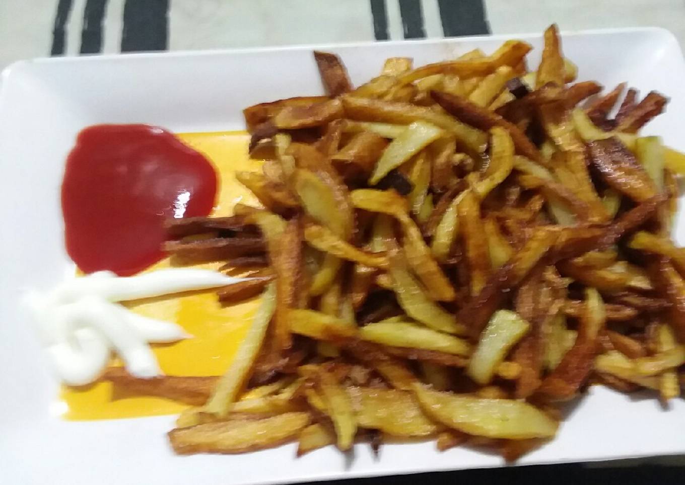 French fries with ketchup and mayonnaise