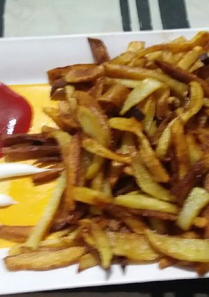 A picture of French fries with ketchup and mayonnaise.