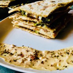 A picture of Broccoli mushroom wholewheat quesadilla.