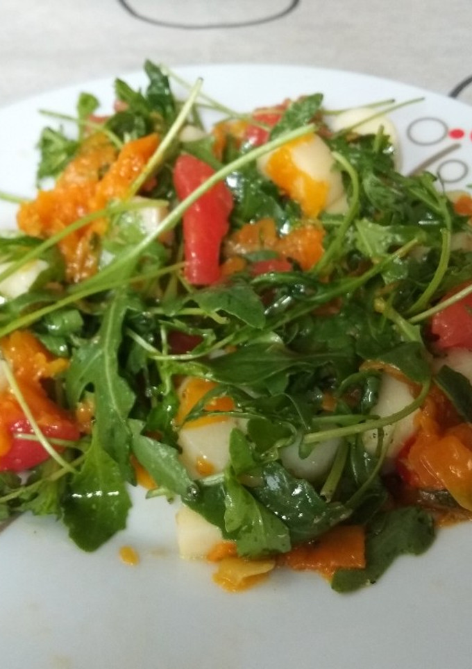 Una foto de Ensalada de rúcula y palmitos