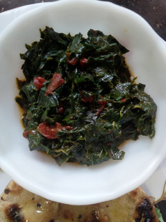 A picture of Terere/dodo served with millet roti, jaggery#vegetables.