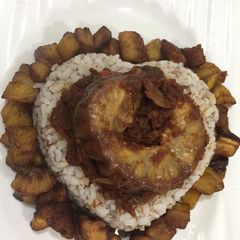 A picture of Ofada rice with dodo.