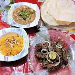 A picture of Halva Puri with gola kabab.