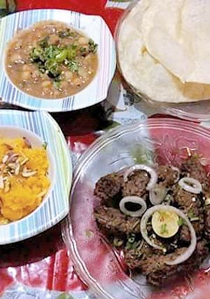 A picture of Halva Puri with gola kabab.