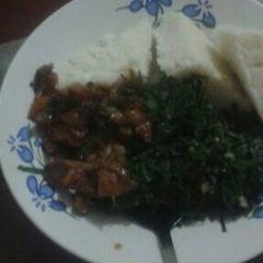 A picture of Ugali with beef and sukuma wiki.