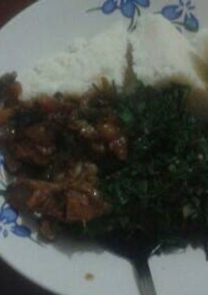 A picture of Ugali with beef and sukuma wiki.