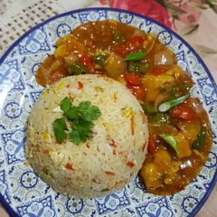 A picture of Egg Fried Rice and Chicken Manchurian.