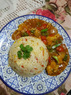 A picture of Egg Fried Rice and Chicken Manchurian.