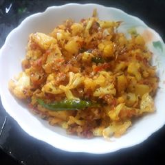 A picture of Cauliflower with dry fenugreek leaves.
