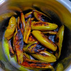 A picture of Potol Bhaja: Fried Pointed Gourd.