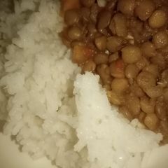 A picture of Coconut rice and kamande(lentils).