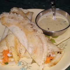 A picture of Masala Dosa With Coconut Chutney.