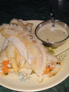 A picture of Masala Dosa With Coconut Chutney.