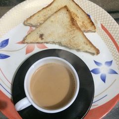 A picture of Masala chai with cheese sandwich.