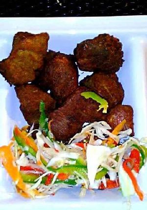 A picture of Fried pork/ sweet plantains.