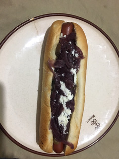 Una foto de Perrito con cebolla caramelizada