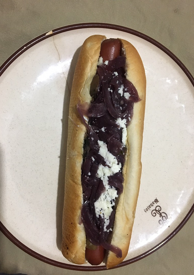 Una foto de Perrito con cebolla caramelizada