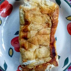 A picture of Fried Bread Sandwiched with Light Spread.