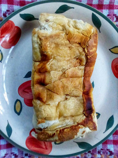 A picture of Fried Bread Sandwiched with Light Spread.