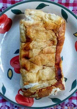 A picture of Fried Bread Sandwiched with Light Spread.