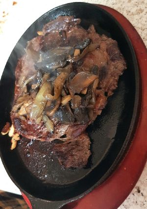 A picture of My Sizzling Steak, Garlic Mushrooms & Onions. 😋.