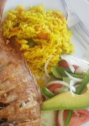 A picture of Fish and green salad.