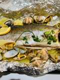 Spigola al cartoccio con vongole