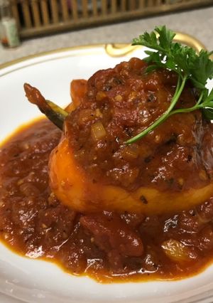 A picture of Stuffed Bell Peppers with Tomato Sauce.