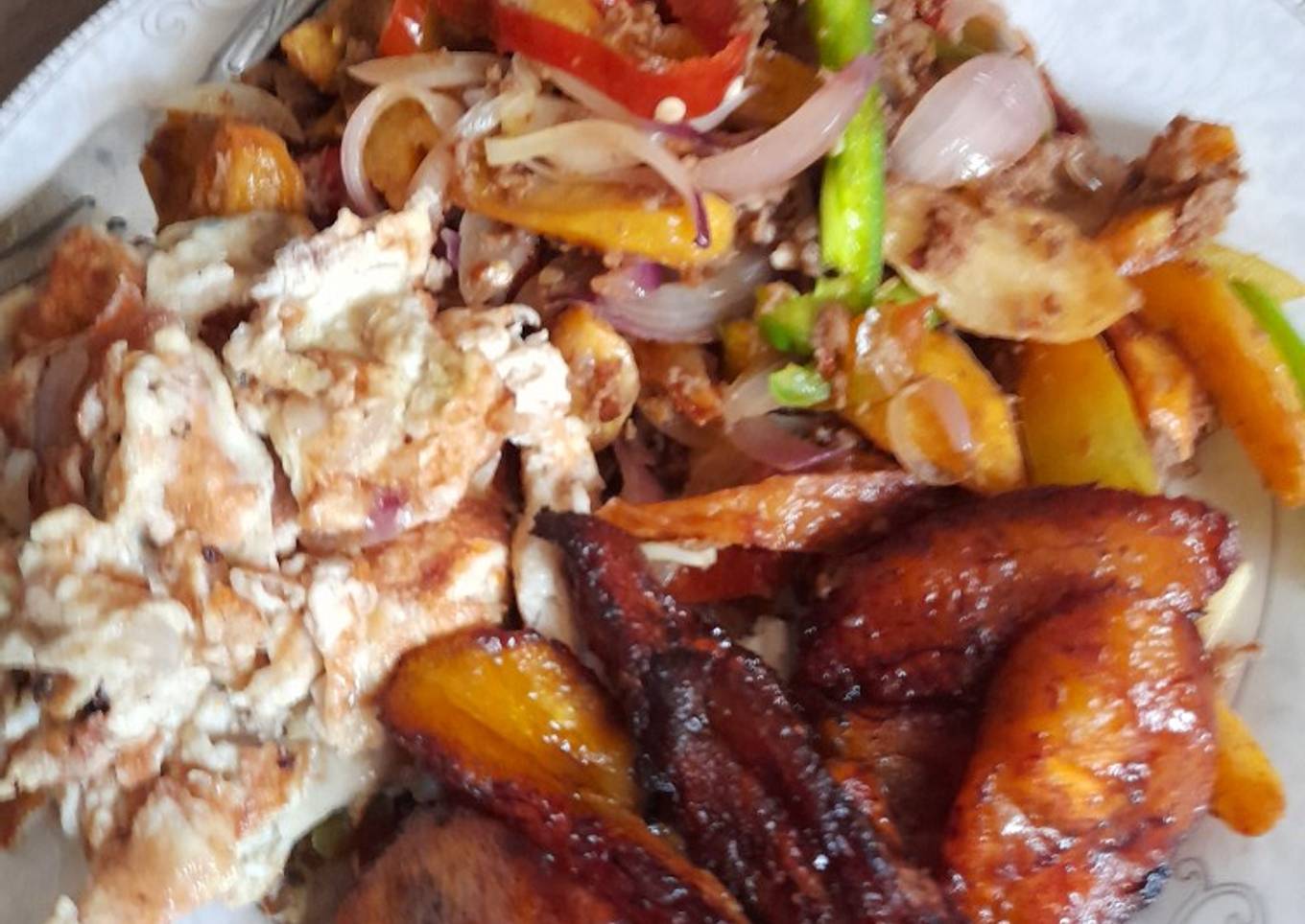 Potato beef stir fry, fried plantain with scrambled eggs